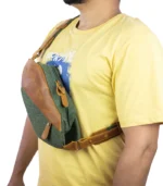 Olive Voyager leather crossbody bag by Sukoon worn chest