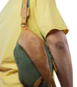 Olive Voyager leather crossbody bag by Sukoon worn back shoulder